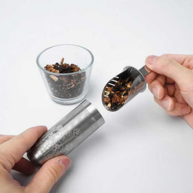 01liv infuser spoon resting in a cup for convenient daily use