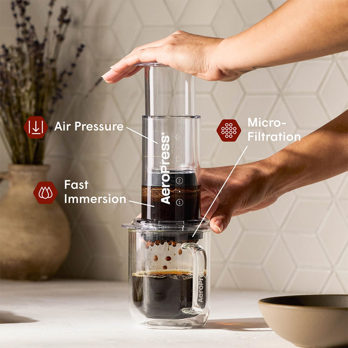 AeroPress filter being inserted into the brew chamber for smoother extraction.
