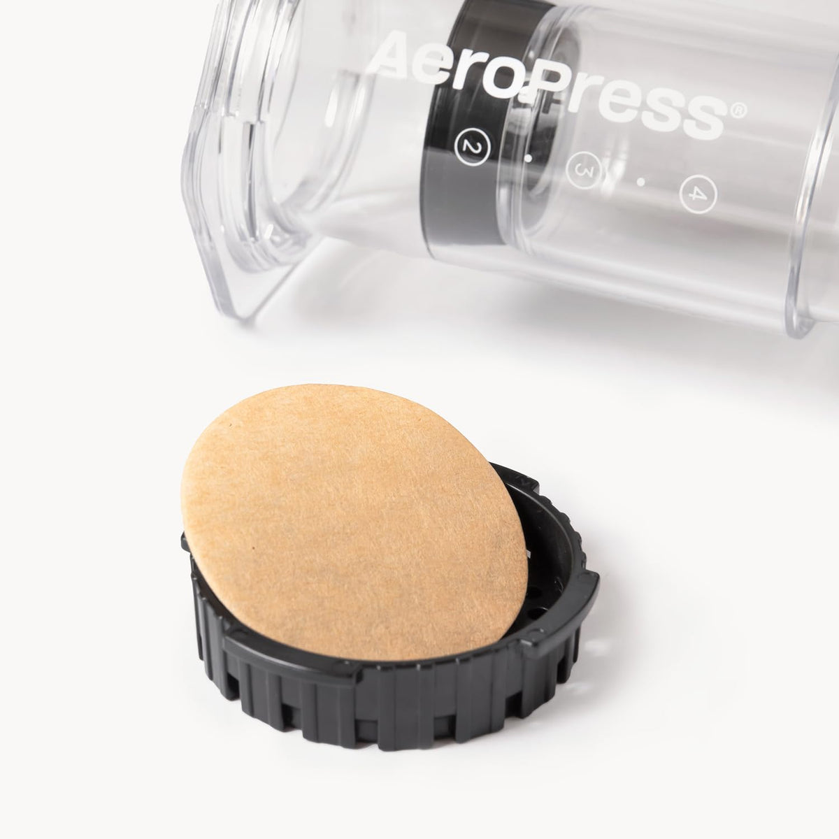 AeroPress unbleached filter paper closeup, eco-friendly filtration for brighter cups
