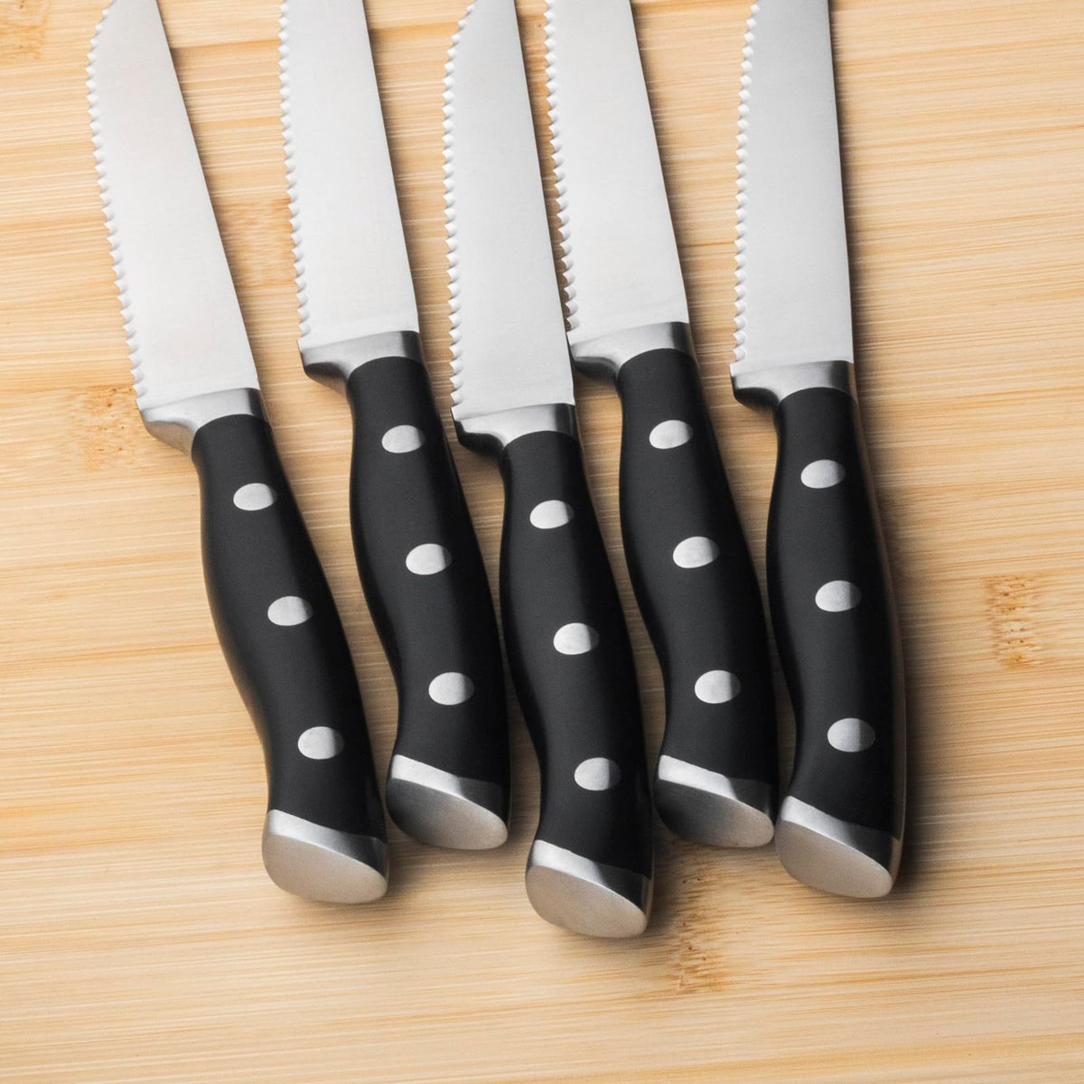 Alata full-tang ergonomic-handle knife delivers balanced control during meals.