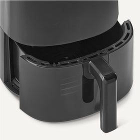 Amazon Basics air fryer with removable crisper plate for easy, mess-free cooking.