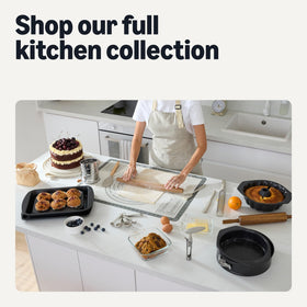 Amazon Basics compact cake carrier fits standard cabinets for easy storage.