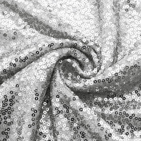 Aormenzy table runner combines durable polyester with dense sequins for longevity.
