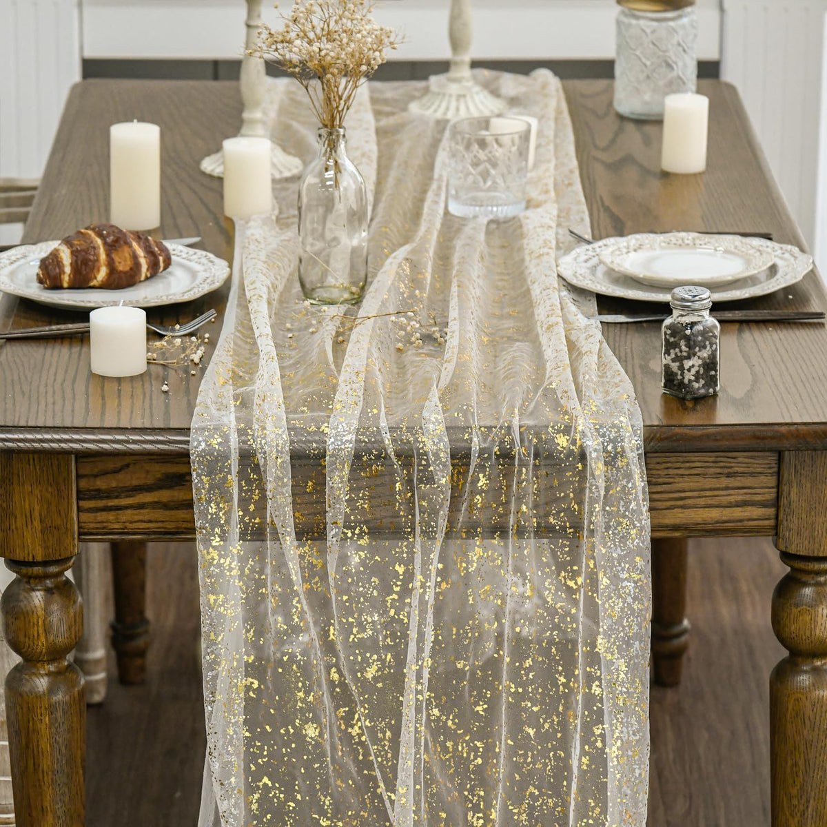 Artoid Mode glitter finish on beige-gold gauze runner enhances festive table settings
