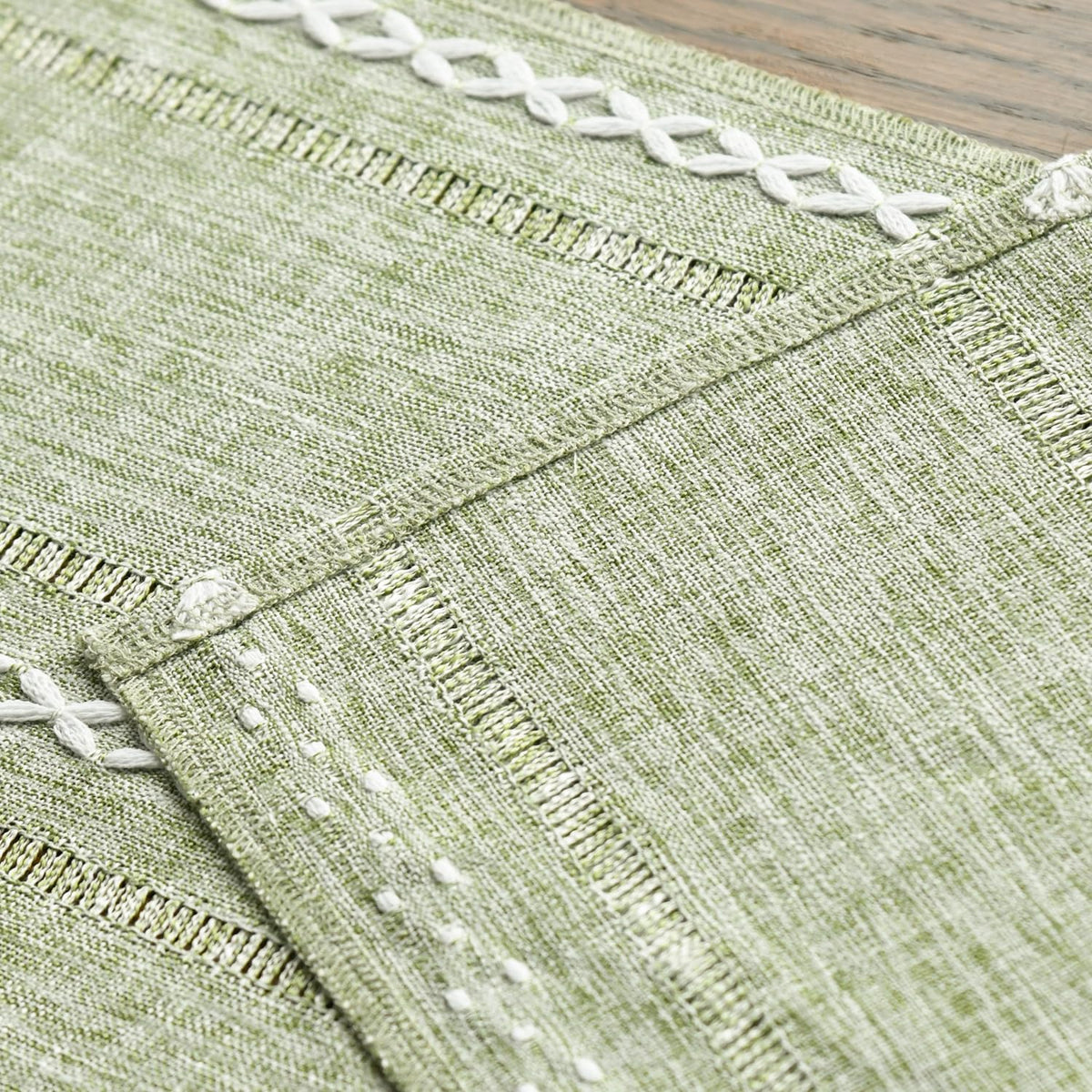 Artoid Mode sage green table runner on a dining table for gatherings.