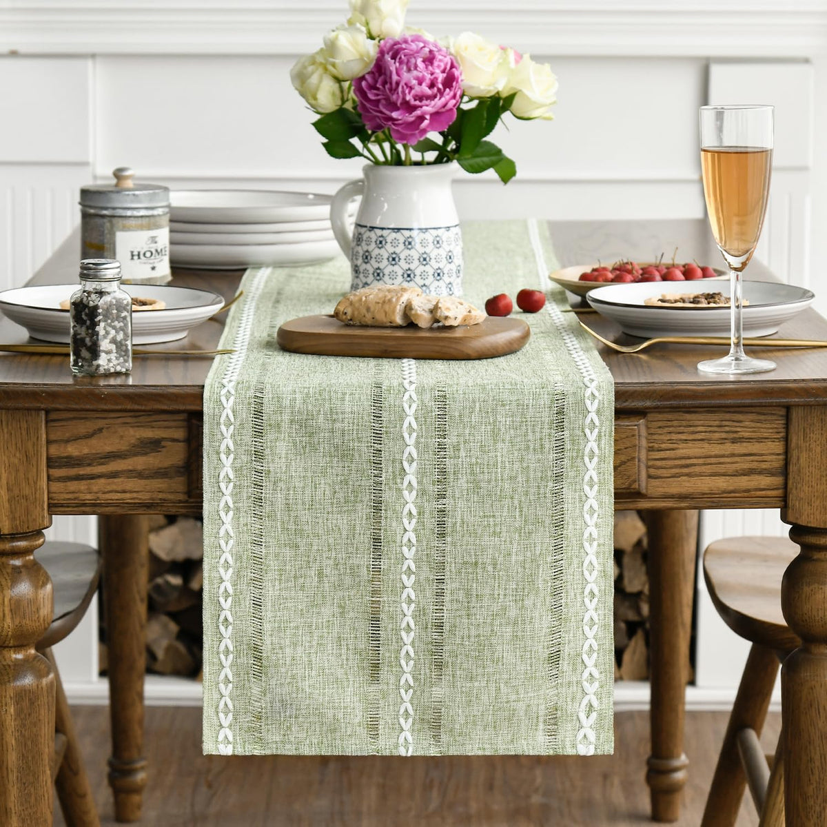 Artoid Mode sage green table runner hollow-out design adds decorative texture.