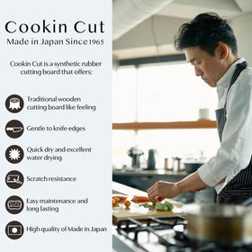 Asahi Cookin Cut rubber cutting board side profile shows slim thickness for storage.