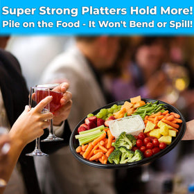 Avant Grub black round catering tray with clear dome lid keeps hors d oeuvres fresh.