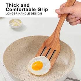 Ayiaren teak spatula slotted for draining liquids while cooking.