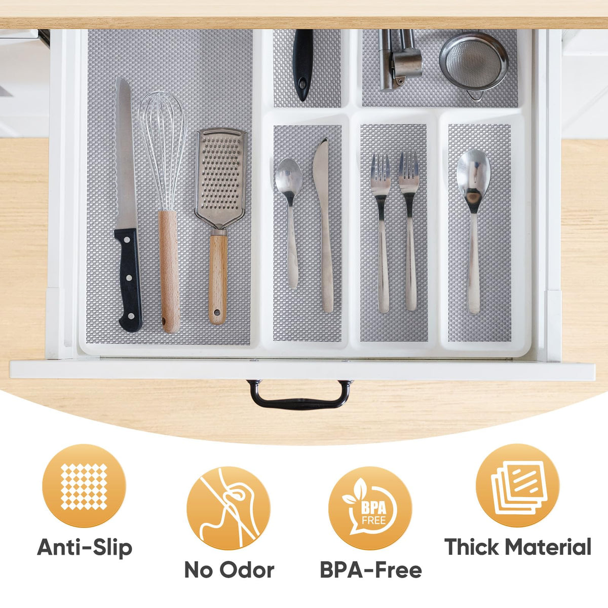BALEINE cabinet liner in a drawer keeps items organized and stable.
