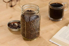 Ball glass jar filled with juice showing clear BPA-free design.