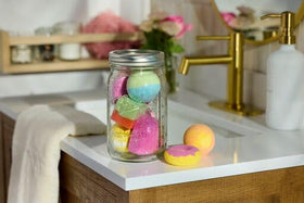 Ball jar on shelf with bands ready for crafting projects.