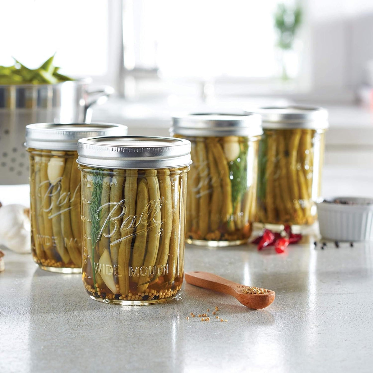 Ball Mason wide-mouth jar with lids for 16oz use, ideal for jams or spices.