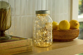 Ball mason jar on pantry shelf for organized storage