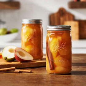 Canning setup with Ball jars ready for preserves and crafts.