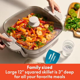 BELLA Make & Take electric skillet with lid open shows the large 12-inch cooking surface.