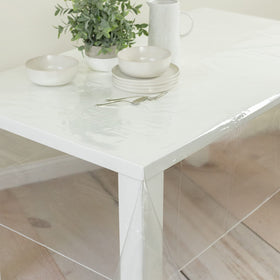 Benson Mills transparent tablecloth used over linens for easy cleanup
