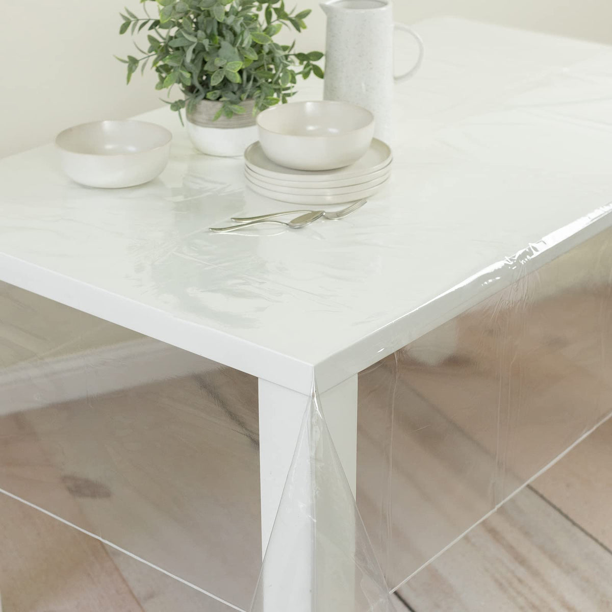 Benson Mills transparent tablecloth 60x124, lets natural grain show while guarding against stains.