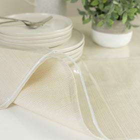 Benson Mills wipe-clean table protector 60x108, prevents spills and keeps surfaces pristine.