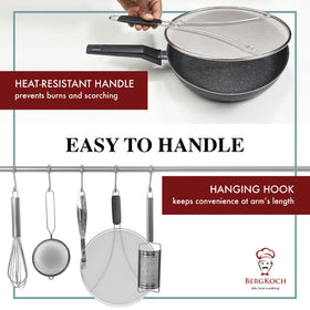 BergKoch splatter screen with a plastic handle protects hands during cooking