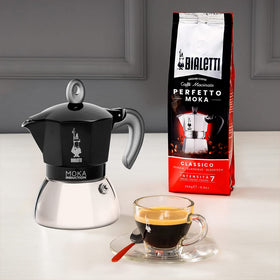 Bialetti Moka Induction espresso pouring captures rich aroma and crema-like extraction.