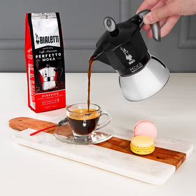 Bialetti Moka Induction lid and handle highlight ergonomic design for easy pouring.