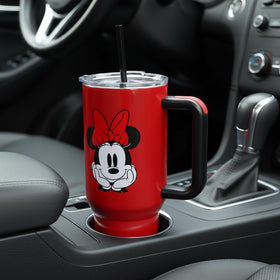 Bioworld Minnie Mouse 40oz tumbler size reference with hand for scale.