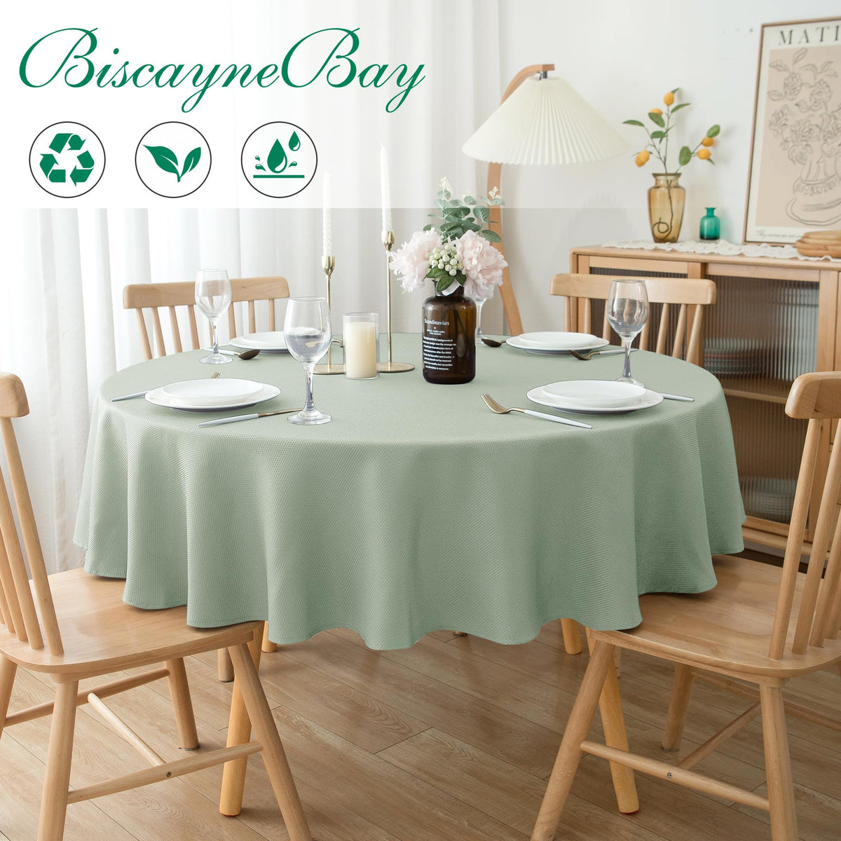 Biscaynebay sage tablecloth draped on a round table for a refined look.