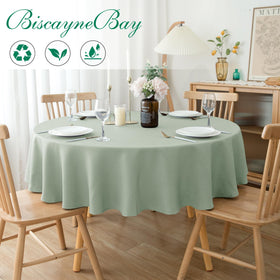 Biscaynebay sage tablecloth draped on a round table for a refined look.