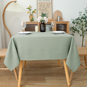 Biscaynebay Sage tablecloth shows water-bead resistance for spills and quick cleanup.