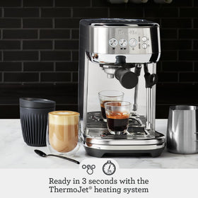 Breville Bambino Plus milk texturing wand demonstrates automatic microfoam