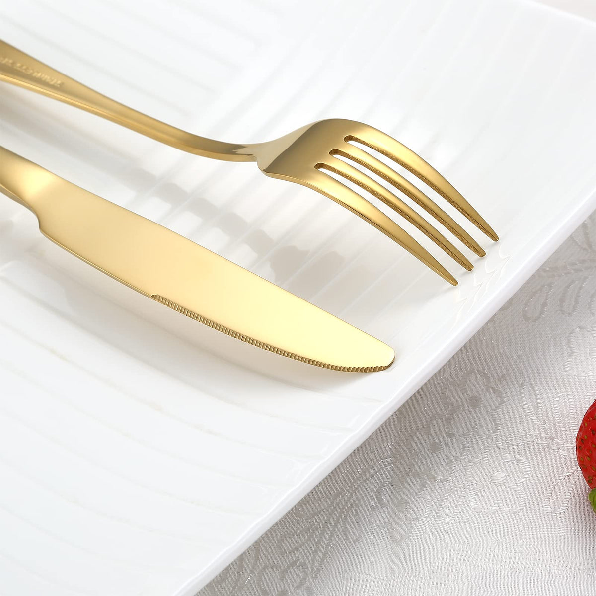 BRIOUT gold dinner knives pair with modern tableware.