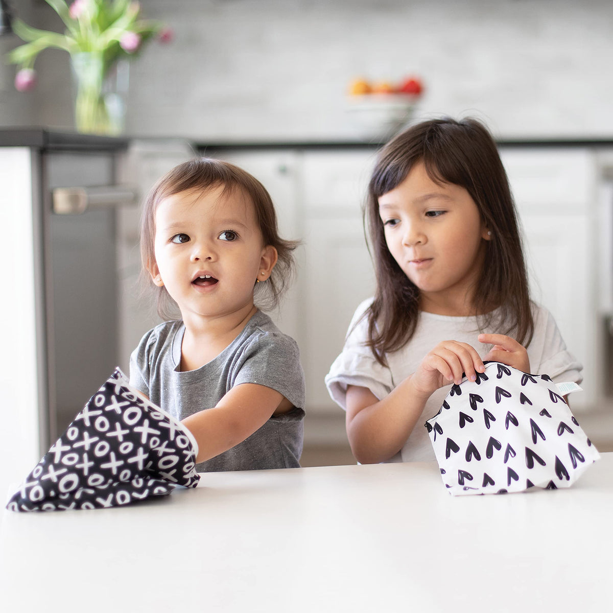 Bumkins snack bag with hearts pattern ideal for kids' school lunches.