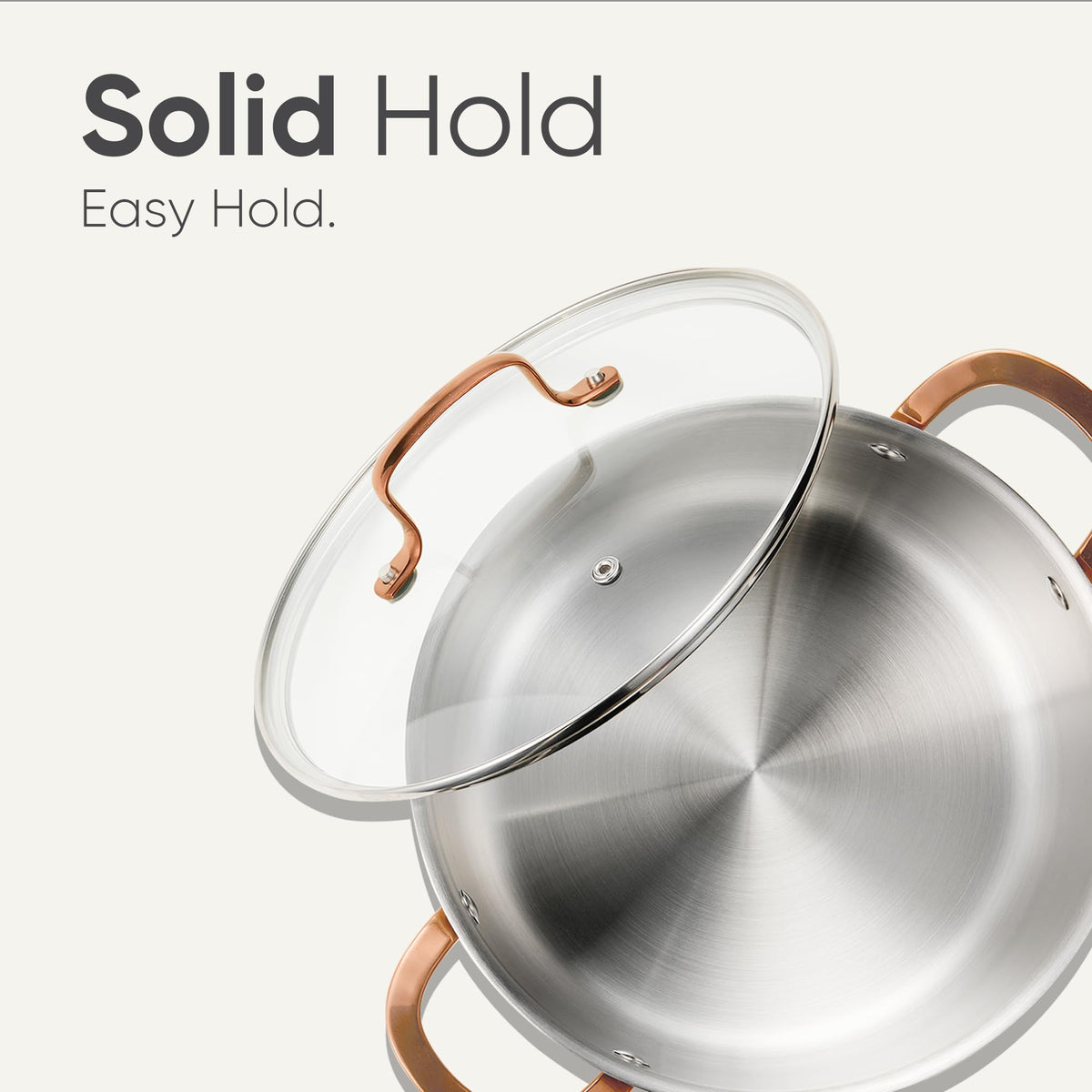 CAROTE stockpot on stove shows oven-safe and universal compatibility.