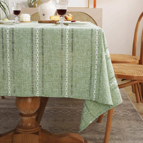 Chassic family dining scene with tablecloth; cozy, inviting meals.