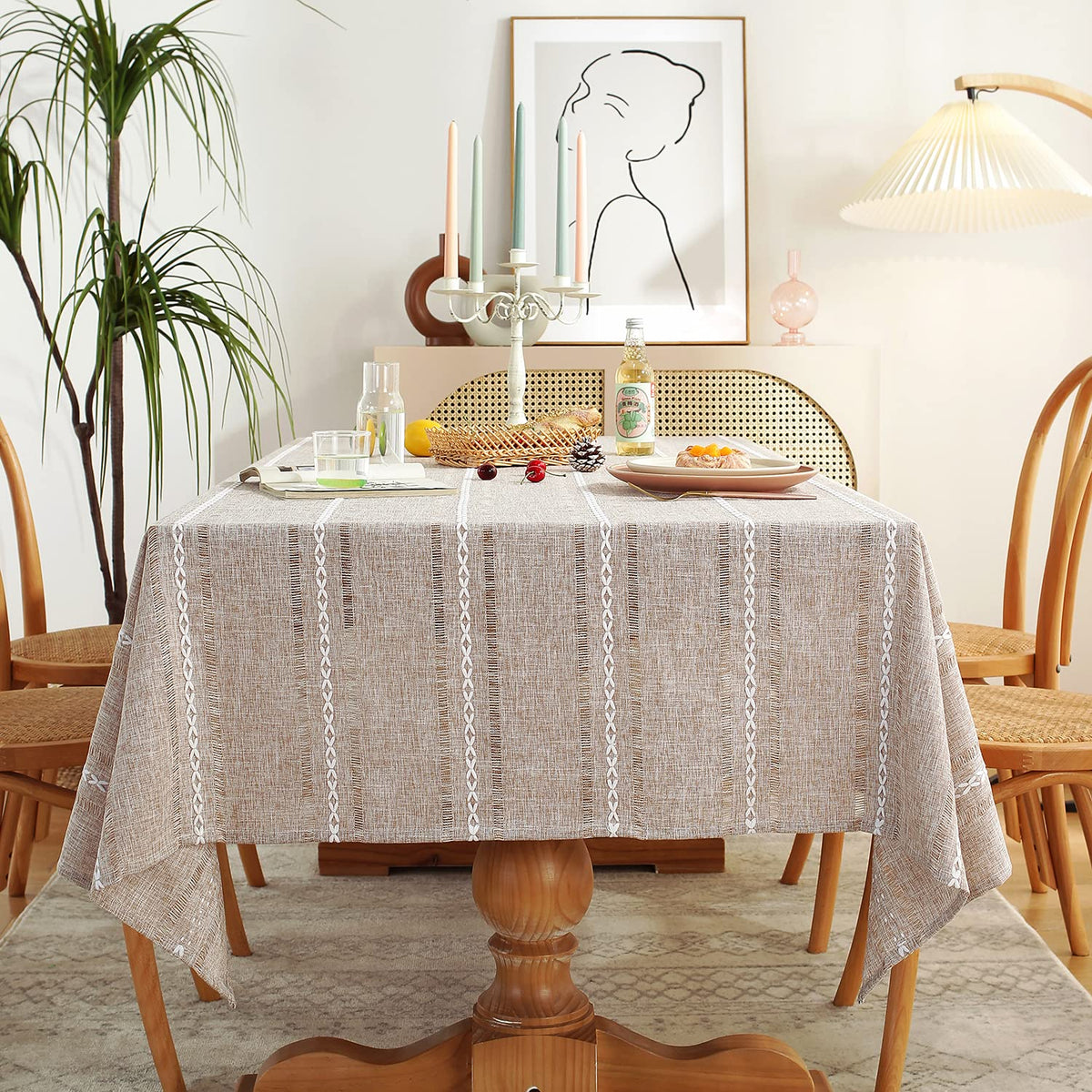 Chassic hemstitched light coffee tablecloth on a rectangular table for a refined dining setup
