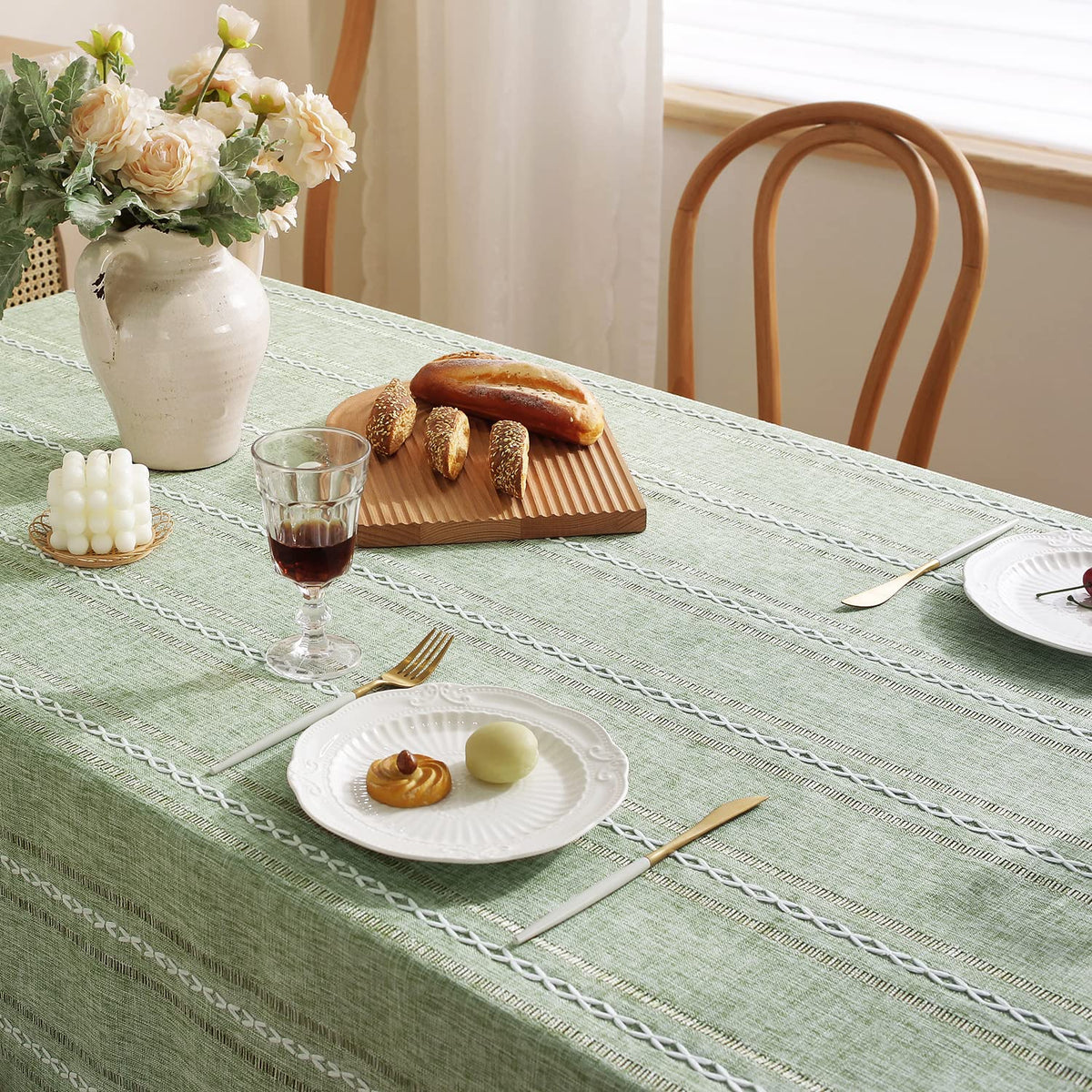 Sage green Chassic tablecloth arranged in a bright dining setting.