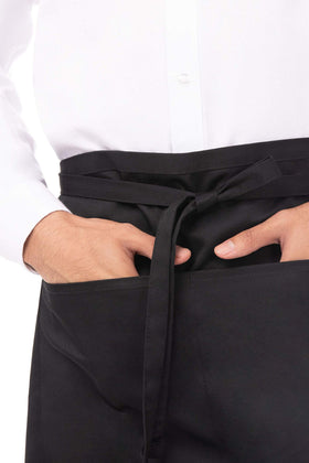 Chef Works half bistro apron pocket detail with large front pocket and center divider.