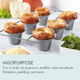 Close-up of popover pan cups highlighting deep tapered design for even baking