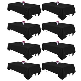CKIKU black 8ft rectangle tablecloth covering a long dining table with a smooth, polished drape