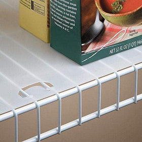 Conimar shelf liner with locking tabs on wire shelf, preventing items from slipping.