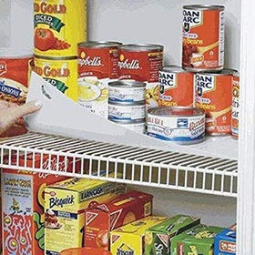 Conimar shelf liner trimmed to fit a 16-inch shelf, creating a stable surface.