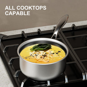 COOKER KING stainless steel handle close-up emphasizing stay-cool grip.