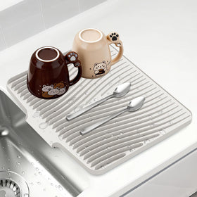 COPLIB silicone dish drying mat with ample space for dishes and air-drying.