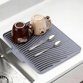 COPLIB silicone dish drying mat with built-in drain keeps counters dry after washing