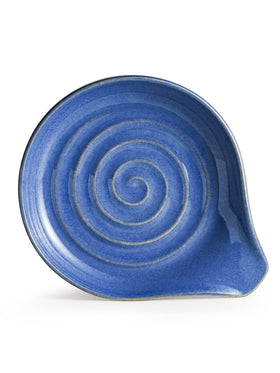 Cormomu spoon rest with glossy swirled glaze sits on the countertop, adding style.