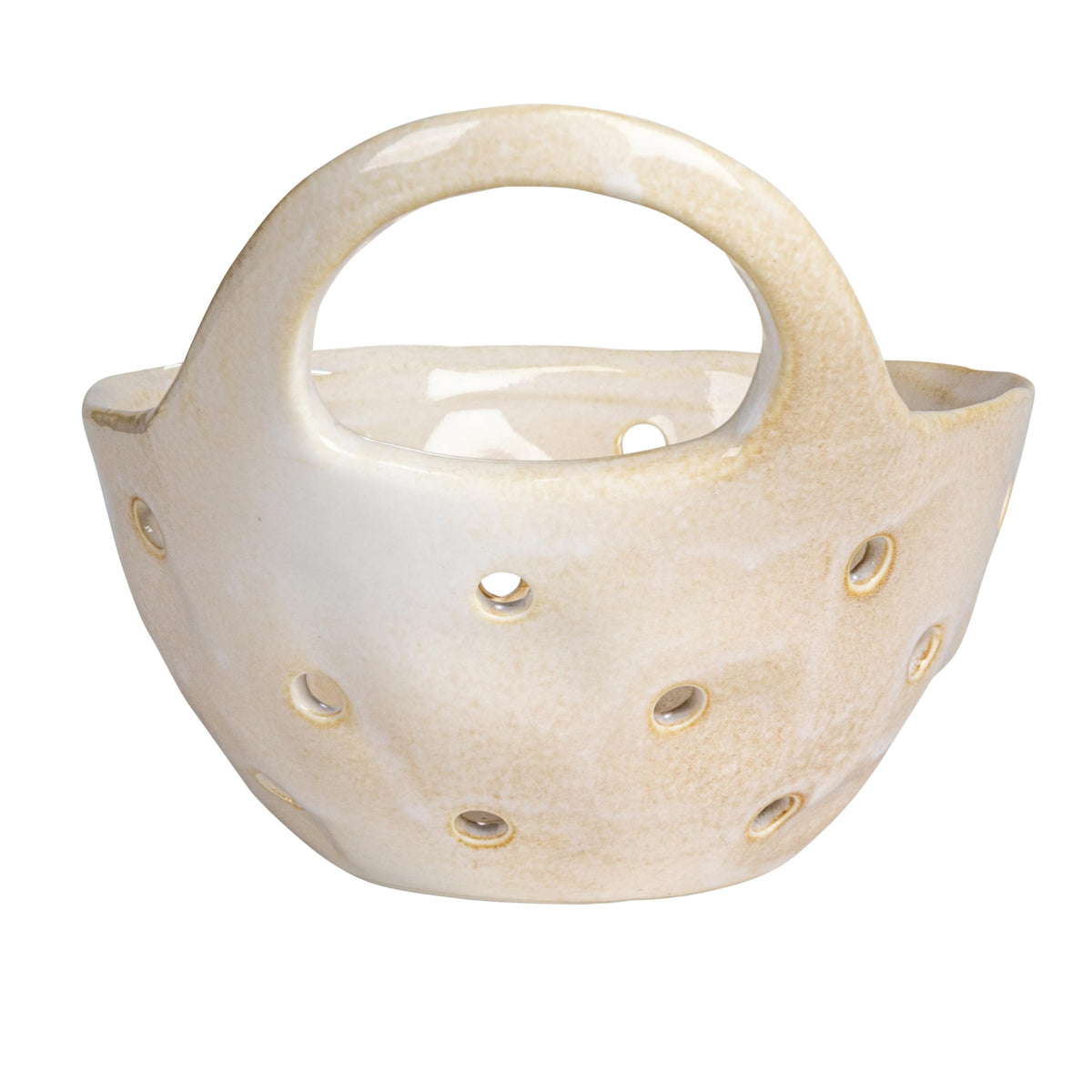 Creative Co-Op Cream Stoneware Colanders on shelf beside a plant for decor