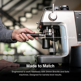 CREMA bottomless naked portafilter demonstrates live shot flow for technique tuning.