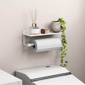 Bathroom shelf stores towels and essentials, keeping surfaces tidy.