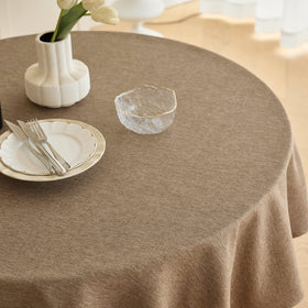 Decorelia faux linen round tablecloth in coffee color adds timeless style to dining.